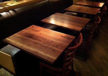 Custom made solid wood Black Walnut table tops at Chicago restaurant from Spiritcraft Design Furniture in Dundee, Illinois.