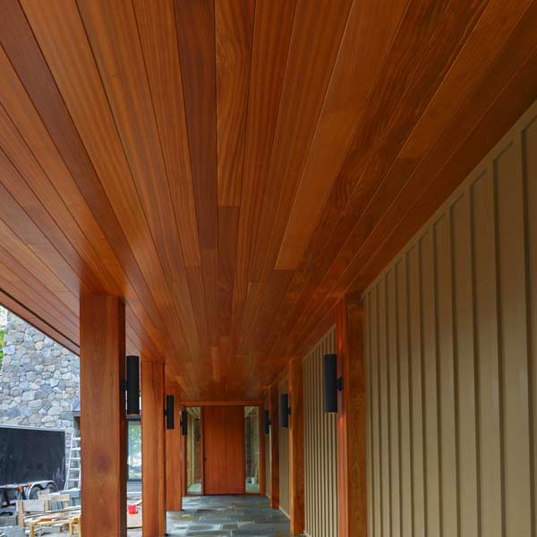 Pivot door and massive Sapele Mahogany columns and half columns in Bar Harbor, Maine made by by Spiritcraft Furniture