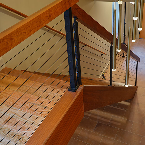 Custom open stairway for new construction residential home in Sapele Mahogany