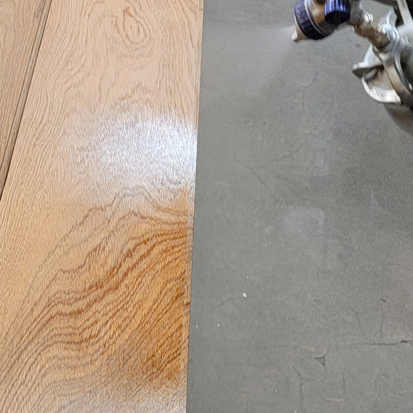 Milled V Groove Cladding in Sapele Mahogany Being Sprayed with Milesi Class A Fire-rated and UV Top Coats