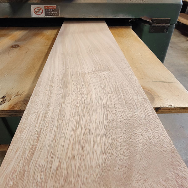 Thickness Planing African Mahogany boards for tongue and groove cladding job