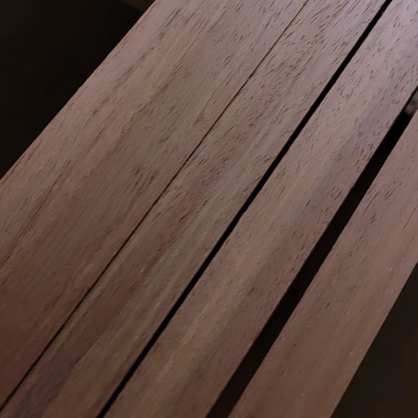 Custom Peruvian Walnut Millwork Trim for National Retail Store Chain Being Wide Belt Sanded