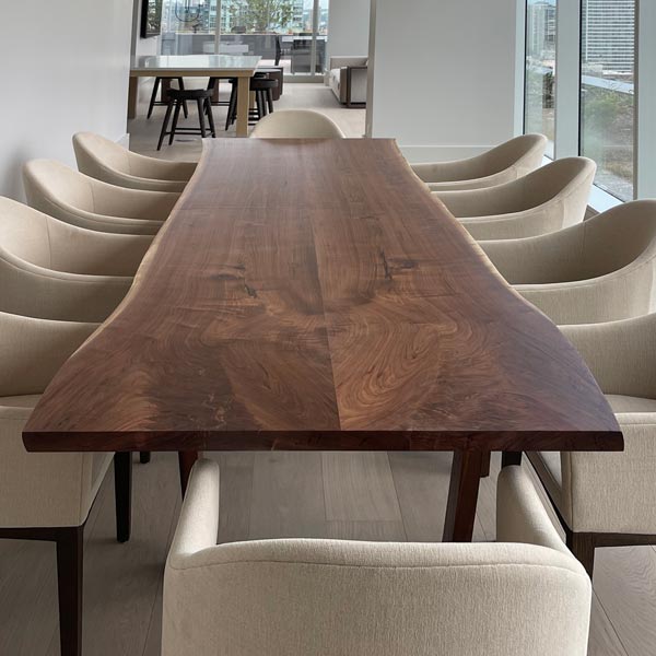 12 foot long live edge walnut table for corporate apartment for hospitality designer