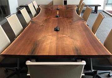 fourteen foot Live edge Black Walnut conference table crafted from solid kiln dried slabs