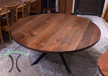 Custom made solid hardwood Walnut round table top on spider leg base for New York residence