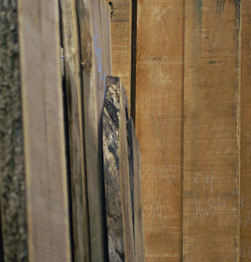 Thick red and clear boards of wide Cherry lumber in 8/4 at Chicago area wood store, Great Spirit Hardwoods in East Dundee, IL