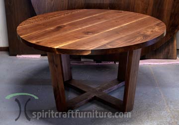 Modern Walnut dining table with four leg trap base for Chicago area client by Spiritcraft Furniture in East Dundee, Illinois.