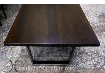 Wide Plank Black Walnut, Stained Ebony with Polished Stainless Trapezoid Legs for Chicago Client from Spiritcraft Furniture, East Dundee, IL.