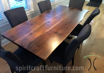 Dining table from live edge slabs of kiln dried Black Walnut by Spiritcraft Design Furnitue in East Dundee, Illinois.