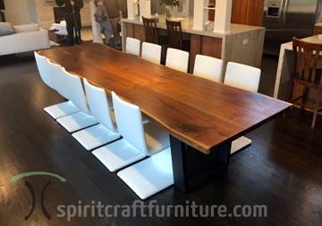 Twelve foot long live edge Walnut dining table for north shore Chicago client by Spiritcraft Furniture in East Dundee, Illinois