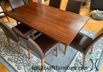 Sapele Mahogany Dining Table in Ribbonstripe Grain with Spider Base and Leather Chairs from our furniture store in Chicago area, East Dundee, Illinois