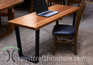 African Mahogany Solid Wood Desktop on Trapezoid Shape Steel Legs Painted Flat Black in our Chicago, Illinois area Showroom